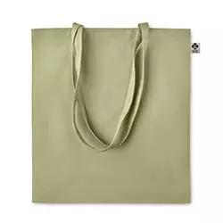 Shopper in cotone organico di colore verde su sfondo bianco
